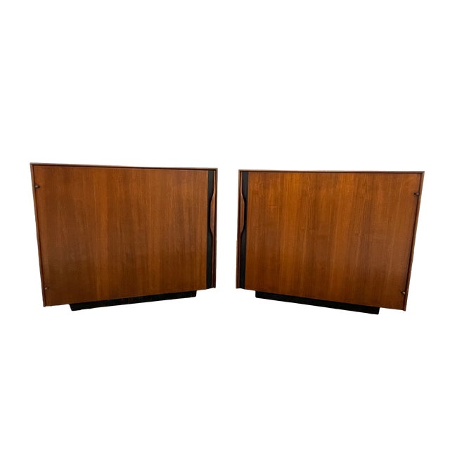 Pair of walnut nightstands attributed to John Kapel for Glenn of California, circa 1960s. These pieces are not labeled;...