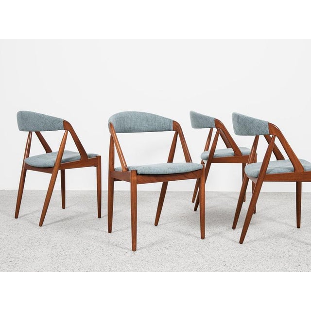 This set of 4 dining chairs is designed by Kai Kristiansen and manufactured by Schou Andersen in Denmark in the 1960s....