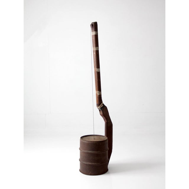 A compelling early 20th century American folk string instrument with a distinctly sculptural, handmade presence. Its...