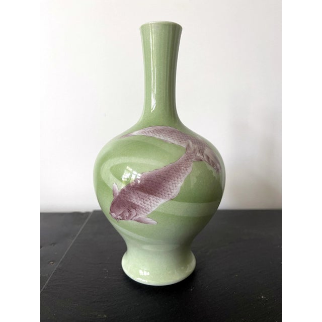 A Japanese long neck porcelain vase circa 1900-1910s by the studio of Miyagawa Kozan (1842–1916), one of the most...