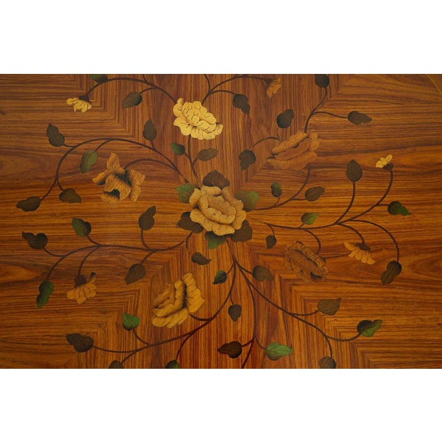 Antique French Napoleon III coffee table in fine exotic woods dating back to the early 20th century. The circular top...