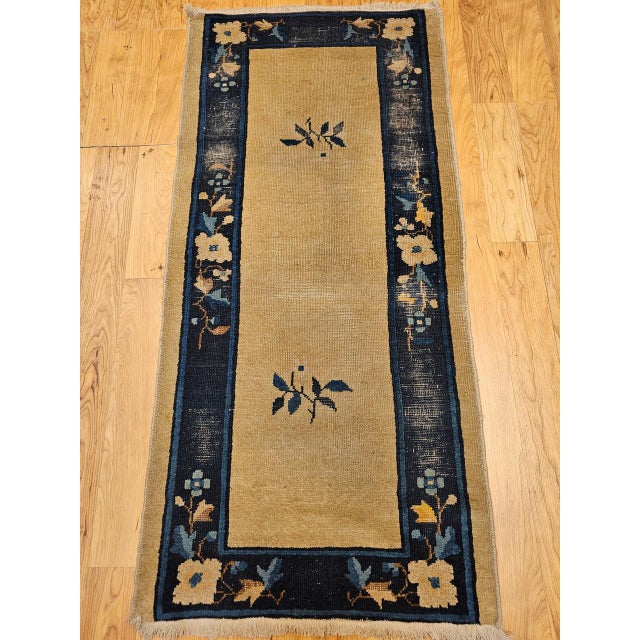 An elegant late 19th century Chinese Peking rug of exceptional delicacy and refinement, featuring a serene open-field...
