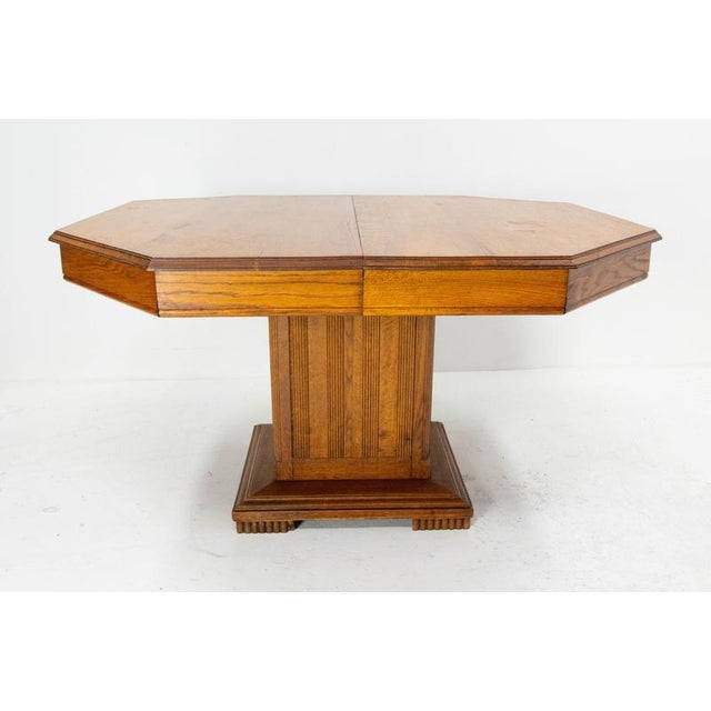 A solid oak dining table dating from the 1940s, this piece stands out for its understated elegance and authentic...