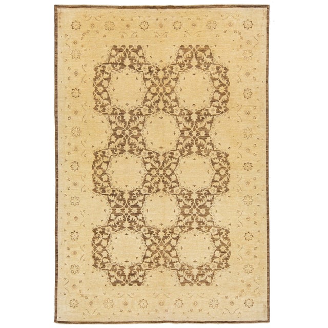 Beautiful hand-knotted wool, vintage Paki Peshawar rug. This rug has a brown field featuring an all over floral design...