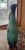 Tall peacock blue and black glazed pottery pitcher with sleek black handle. Spout has a 3 inch opening. Artist marking.
