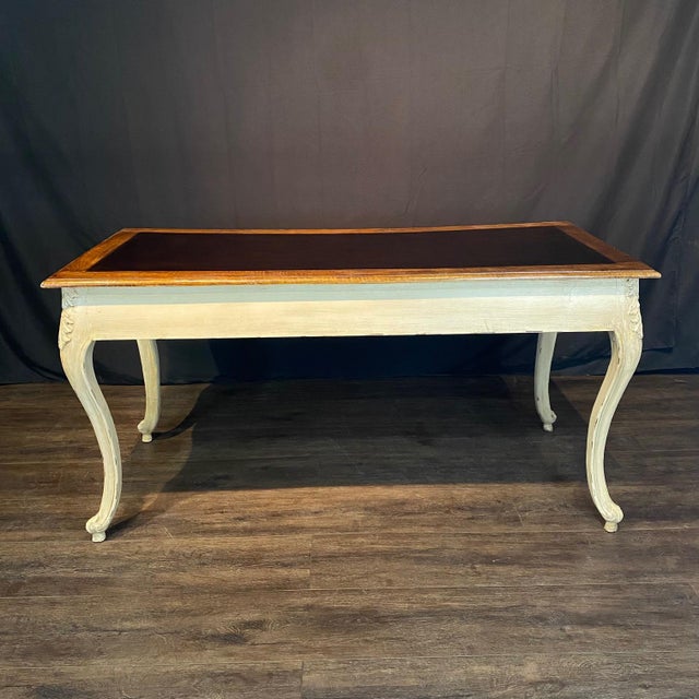 Elegant and spacious French Provincial Louis XV style writing desk with two drawers and white antiqued distressed ivory...