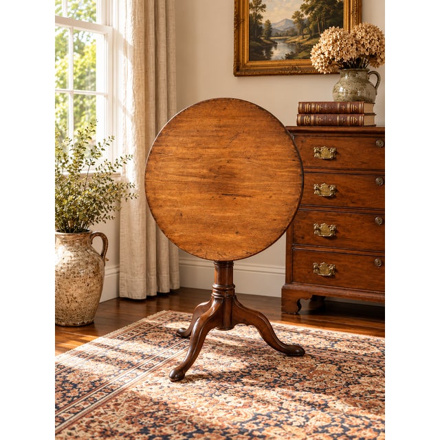 This beautiful antique Queen Anne mahogany birdcage tilt top breakfast table dates to the early 19th century and reflects...