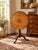 This beautiful antique Queen Anne mahogany birdcage tilt top breakfast table dates to the early 19th century and reflects...