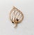 Mid to late 1950s Modernist goldtone strawberry with stem at the top with 3 leaves and wires making up the body of the...