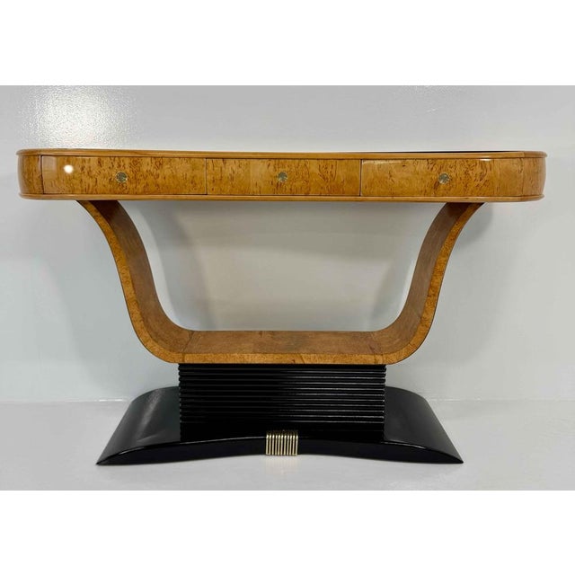 Elegant Italian Art Deco console from the 1940s, featuring a refined structure in warm-toned birch burl. The top is...