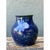 This vintage cobalt studio pottery vase showcases a classically balanced silhouette, its rounded, bulbous body rising...