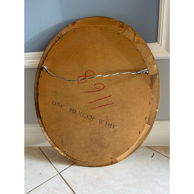 Golden wood framed oval mirror. Measures 20.5” x24.5” . The inside of the mirror is 19”. Ready to hang.