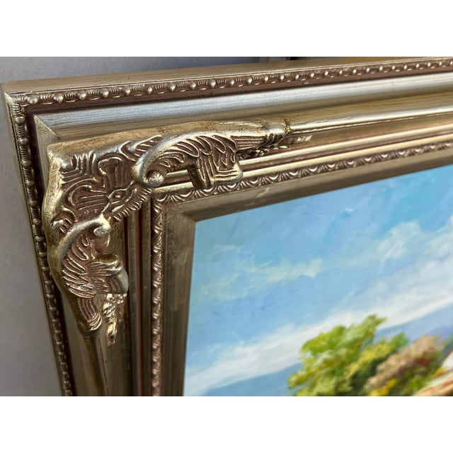 The painting is an original oil on canvas, late 20th-century piece. It features a landscape that has a bright,...