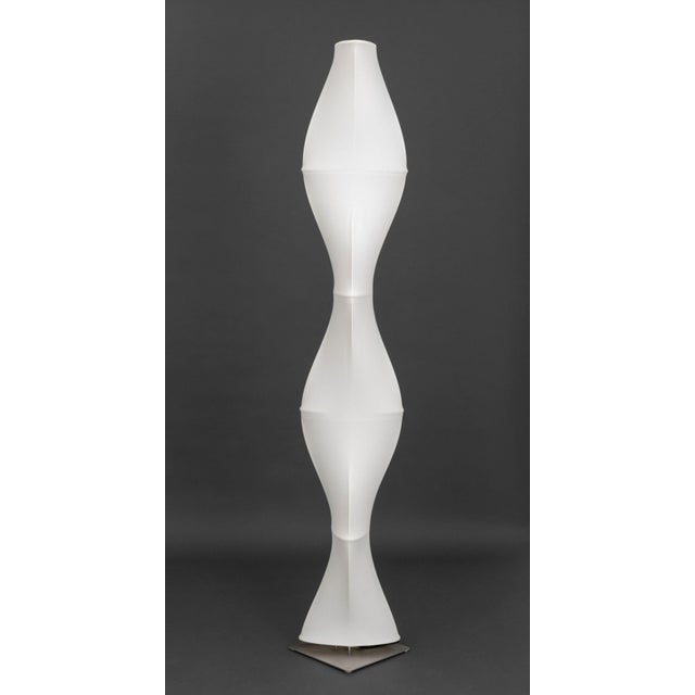 Roche Bobois Dix Heures Dix Minoluce Floor Lamp, with white stretch fabric on stainless steel base, label to underside....