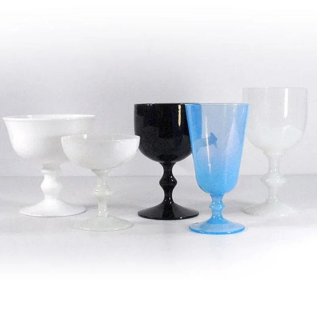 A set of decorative Italian glass from the 1960s and 1970s. The set includes five cups made of various types of glass....