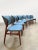 This unique set of six vintage dining chairs from the 1960s adds a touch of color to your interior. The warm wooden frame...