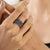 3.41 ct blue sapphires are arranged in three rows, combining pear- and marquise-shaped gemstones in a closely set mosaic...