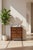 A cerejeira veneered and Khaya nightstand, the rectangular crossbanded top above three graduated drawers, on splayed legs....