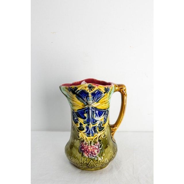 *French Pitcher from Onnaing Manufactures, circa 1900. Art nouveau Barbotine faience pitcher with two purple lilac...