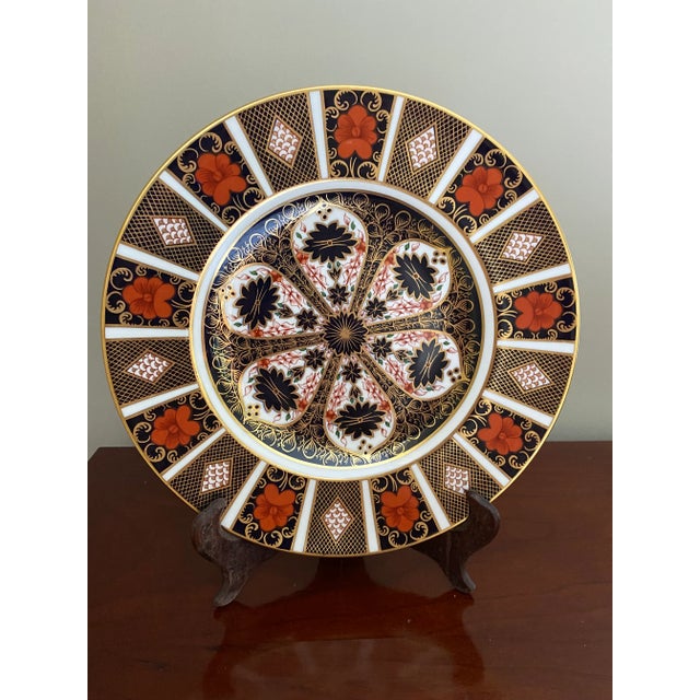 Beautiful vintage Old Imari dinner plate. Iron red, navy blue and 22 carat gold with a 1 3/4" border design.