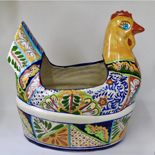 Vibrantly hand-painted large Mexican Talavera chicken planter with intricate rich botanical patterns throughout. I love...