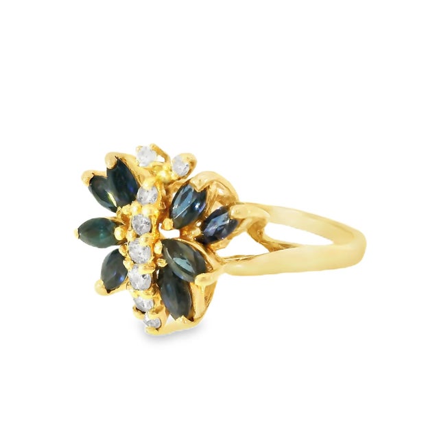 Stunning 14K yellow gold butterfly ring with 8 marquise sapphires and 8 diamonds, a nature-inspired statement piece....