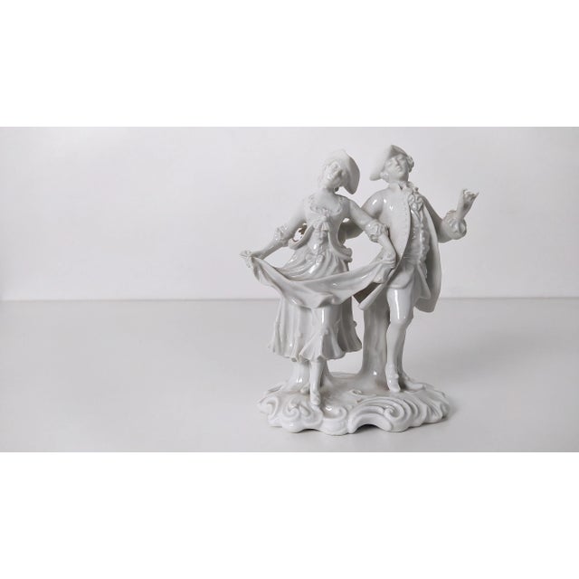 Made in Italy, 1960s. These two 18th century figures are made in Capodimonte porcelain. This statue might show slight...