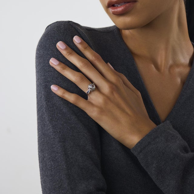 This beautiful Art Deco diamond and sapphire ring is a classic 1930’s design, centered by a GIA-certified cushion...
