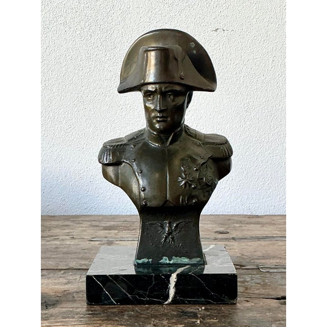 This pensive bronze-finished bust of Napoleon Bonaparte is a quintessential example of Neoclassical revival style,...