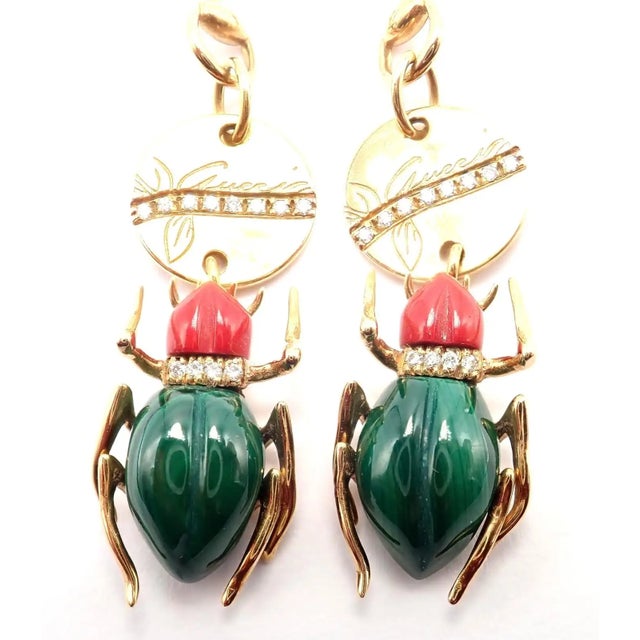 18k yellow gold Diamond Malachite Carnelian Scarab Drop Earrings from Gucci. These Gucci earrings feature intricately...