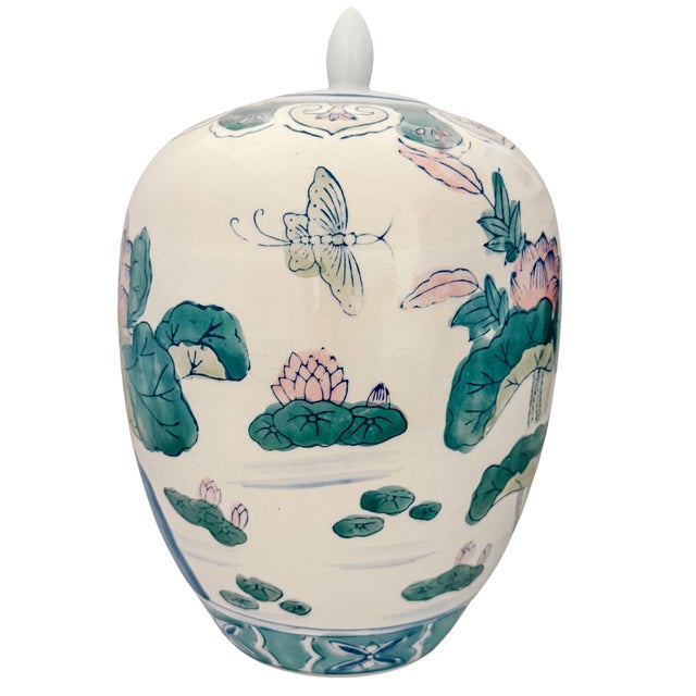 Beautiful vintage lidded porcelain ginger jar hand-painted in a soft pastel palette of celadon, moss green, lotus pink,...