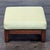 Upholstered ottoman on a wood base. Brand: Ethan Allen. Dimensions (in): 26W x 21D x 16H.