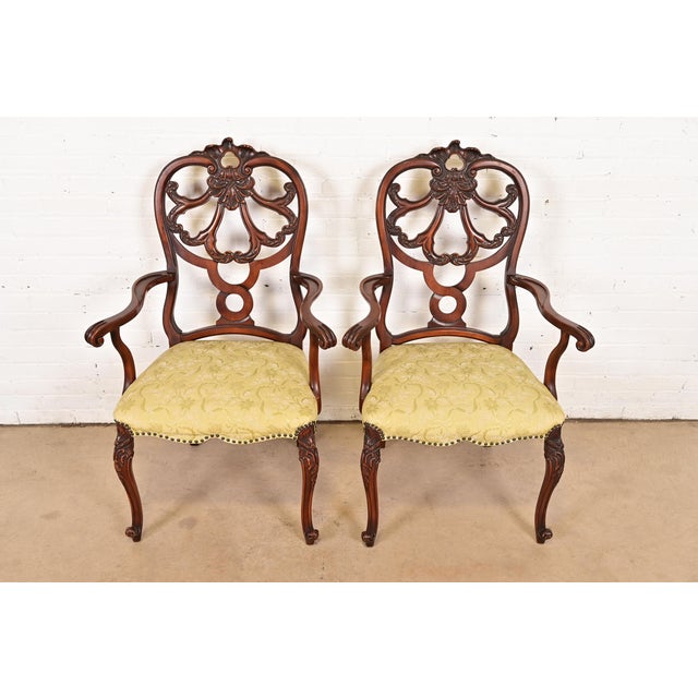 An outstanding pair of antique French Provincial Louis XV style armchairs or dining captain chairs By Romweber USA, Circa...
