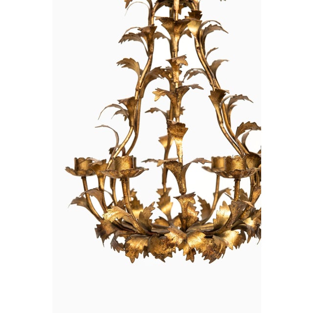 Chandelier in brass. Produced by Svenskt Tenn in Sweden. I have official proof of authenticity such as vintage catalogs,...