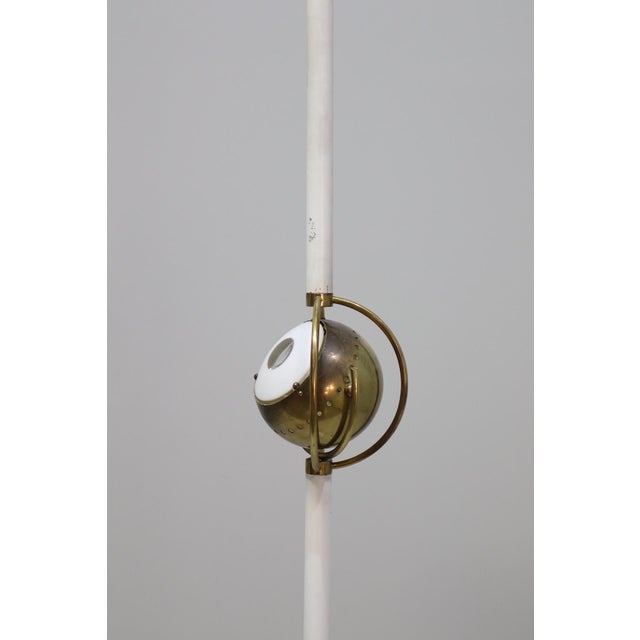 Beautiful and rare floor lamp by Angelo Lelli, model 12555 Occhio. Metal and brass with a marble base. Italy, 1956. This...