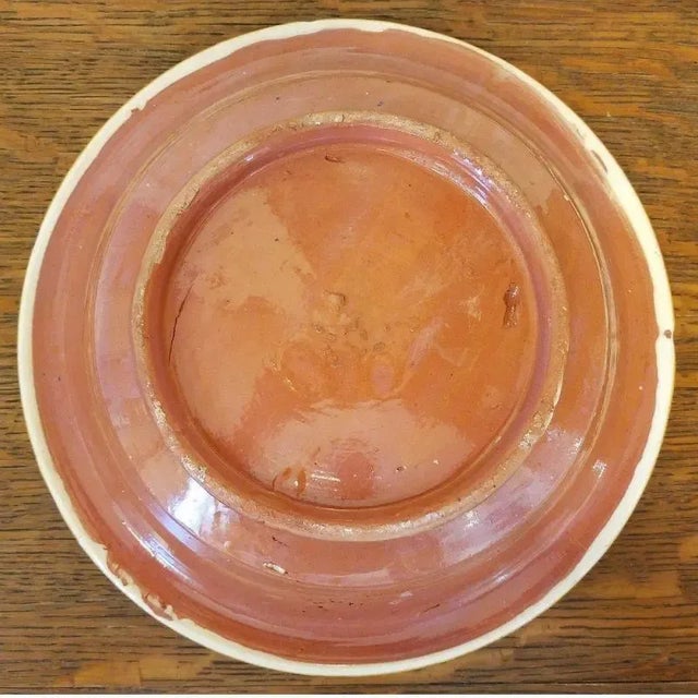 Large, Moroccan Tagine pot, blue and orange color with a traditional fish design. Tagine, or tajine is a dish from North...