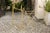 A pair of 1960s Italian brass and glass folding side tables with cast brass hands and sandaled feet. Each of this pair of...