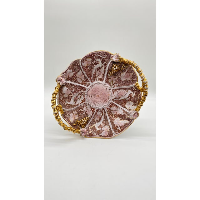 Large round bowl/platter with decorative handles shaped like branches and vines, and four scrolled feet. made in italy,...