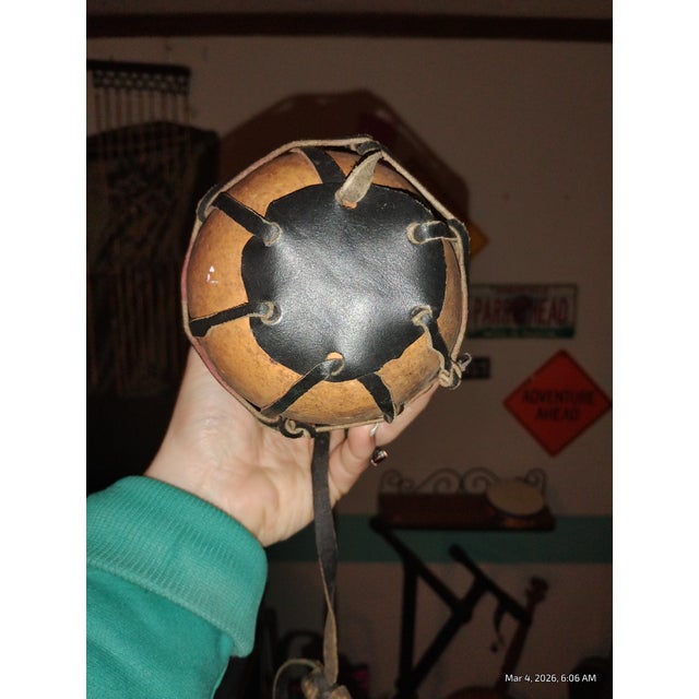 Authentic vintage gourd canteen wrapped in a hand-laced leather harness with rivet details and original strap. Beautiful...
