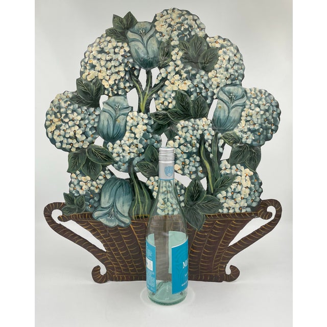 This exquisite vintage hand-painted toleware fireplace screen showcases a charming woven wicker basket with handles...