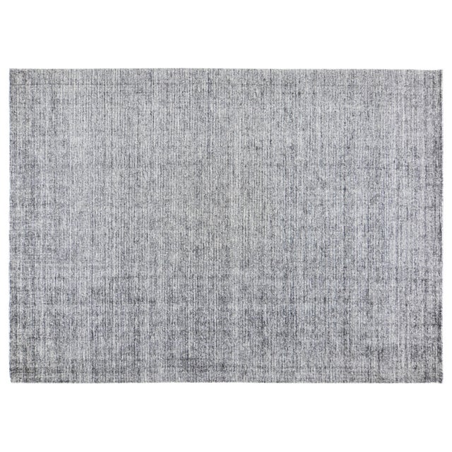 Modern minimalist hand loom rug with plain distressed pile and soft texture.