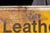Bronze Vintage Painted Tin Tex Tan Western Wear Sign For Sale - Image 8 of 9