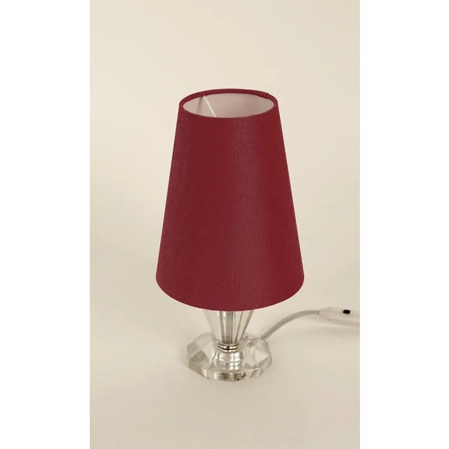 Cute small table lamp with a cut glass base, made in France. The shade is new, made in coral colored silk. This is a very...