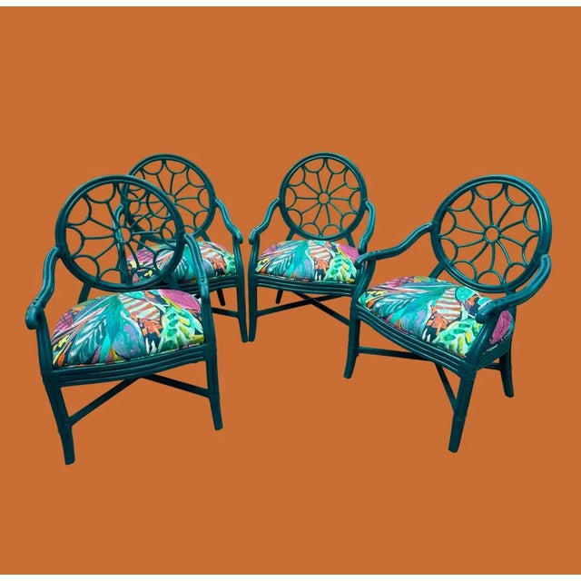 This is a late 20th century dining set by Jessica Charles Furniture. Rattan wrapped with leather straps, spider back...