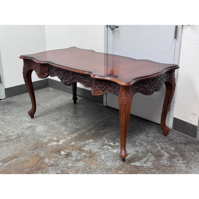 Design Plus Gallery presents a Renaissance Revival Desk. The desk is elegant with a curved shapes and sophisticated...