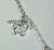 1960s Deco Platinum Charm Necklace For Sale - Image 4 of 9