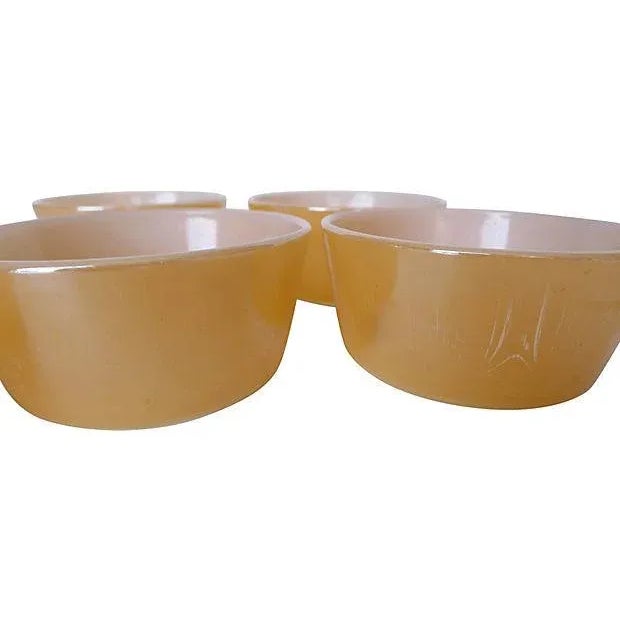 Vintage set of five lusterware dessert bowls. Marked " Fireking". Very good condition; some scratches.