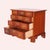 An English Chippendale style chest of drawers attributed to the Williamsburg Bartley Collection offers shaped top over...
