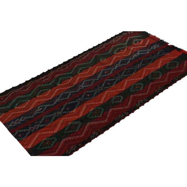 This vintage 4x8 Persian Shiraz kilim is a tribal gallery runner—handwoven in wool circa 1950-1960. Further on the Design:...