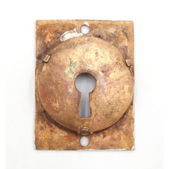 Aesthetic style brass pocket door recessed pull with a keyhole and polished finish. The original mounting screws are not...